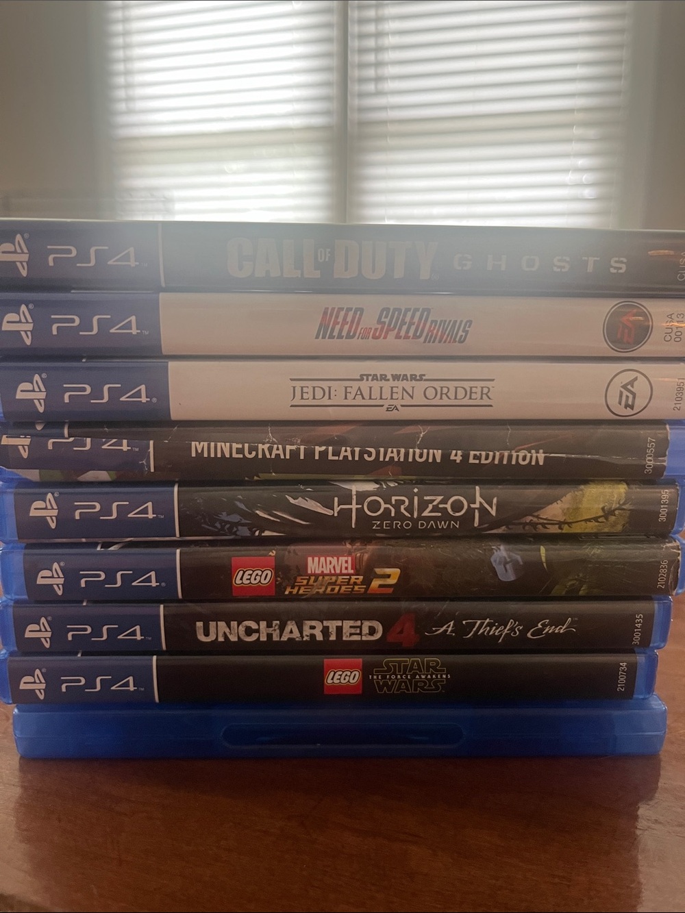Sony PS4 Game Stack with Blue Cases